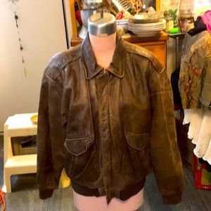 Brown leather coat. It does have 2 spots where the leather has been tore